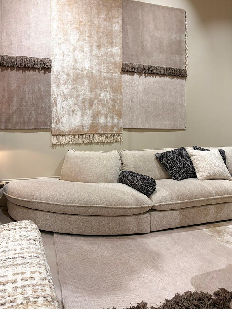 Beige sofa placed against a stylish back wall design in a modern living room interior