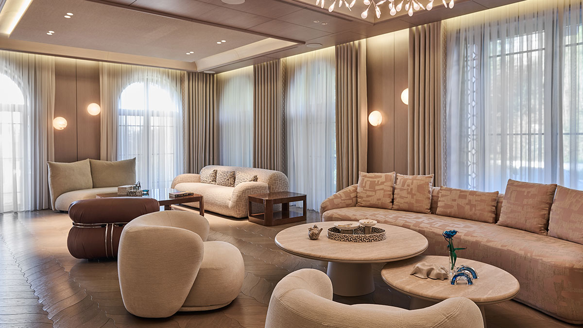 Contemporary luxury lounge interior with curved sofas, soft neutral furnishings and elegant ambient lighting