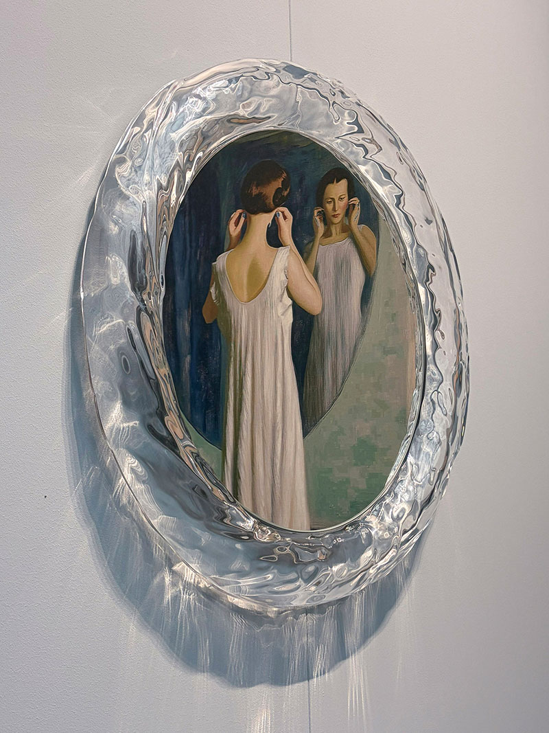 Round mirror style painting of a girl used as modern decorative wall art