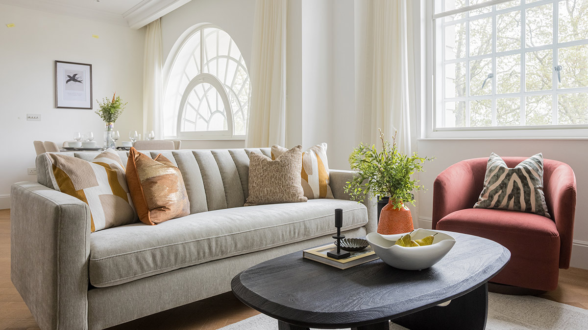Luxury living room with designer sofa, accent chair and coffee table in a professionally furnished Millbank London apartment.