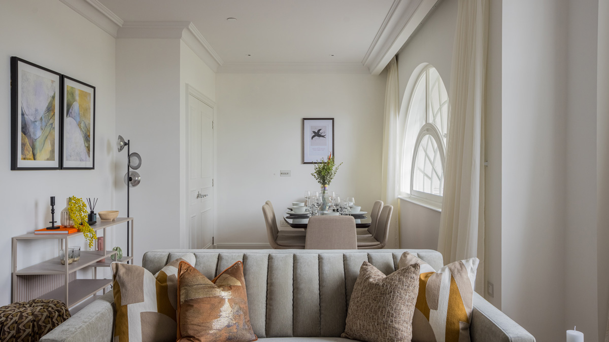 Open-plan living and dining room with contemporary furnishings in a luxury Millbank SW1P apartment.